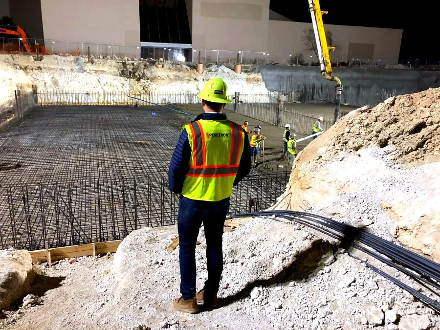 Penetron technical representative reviewing a reinforced slab before the pour
